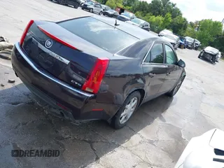 2008 Cadillac CTS RWD w/1SA with VIN 1G6DF577880140148, listed as a IAAI auction lot 42011365 with 156,136 mi miles. Bid and sale history available at carsss.com. Image 3.
