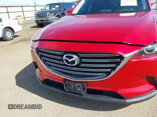 2016 Mazda CX-9 Touring z VIN JM3TCACY9G0122174, wystawiony jako IAAI lot #42613740 z przebiegiem 148 646 mil mil oraz . Historia ofert i sprzedaży dostępna na DreamBid. Obrazek 6.