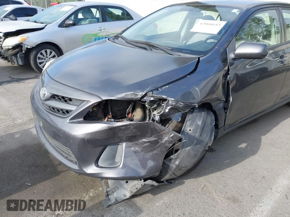 2011 Toyota Corolla L with VIN JTDBU4EE7B9162022, listed as a IAAI auction lot 42066643 with 124,384 mi miles. Bid and sale history available at carsss.com. Image 6.