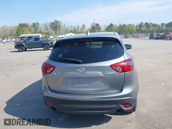 2014 Mazda CX-5 Touring with VIN JM3KE2CY9E0310315, listed as a IAAI auction lot 41943991 with 98,359 mi miles and . Bid and sale history available at carsss.com. Image 16.