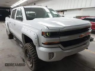 2016 Chevrolet Silverado 1500 LT with VIN 3GCUKREC0GG309315, listed as a IAAI auction lot 41818049 with 98,032 mi miles and . Bid and sale history available at DreamBid. Image 1.