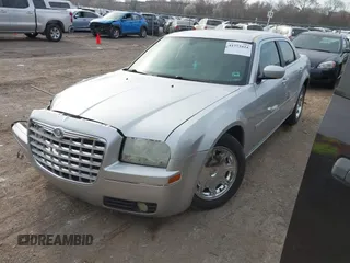 2005 Chrysler 300 with VIN 2C3JA53G85H159623, listed as a IAAI auction lot 41773424 with 127,764 mi miles. Bid and sale history available at carsss.com. Image 2.