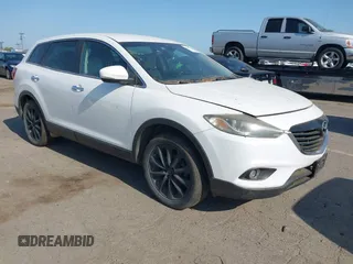 2015 Mazda CX-9 Grand Touring z VIN JM3TB3DV0F0454487, wystawiony jako IAAI lot #42409613 z przebiegiem 132 471 mil mil oraz . Historia ofert i sprzedaży dostępna na DreamBid. Obrazek 1.