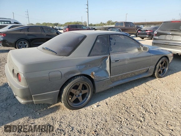 1992 Nissan Skyline z VIN HNR32035831, wystawiony jako Copart lot #74228974 z przebiegiem 49 082 mil mil oraz Szkoda całkowita • Salvage title. Historia ofert i sprzedaży dostępna na DreamBid. Obrazek 4.