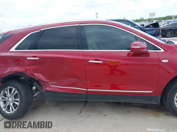 2020 Cadillac XT5 Premium Luxury FWD z VIN 1GYKNCRS8LZ228516, wystawiony jako IAAI lot #42409513 z przebiegiem 54 765 mil mil oraz . Historia ofert i sprzedaży dostępna na DreamBid. Obrazek 13.