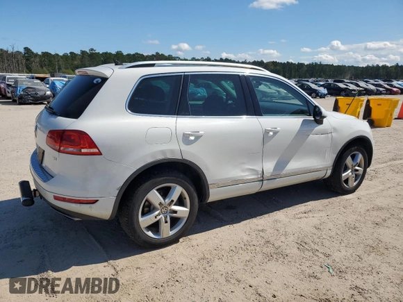 2014 Volkswagen Touareg Lux z VIN WVGEF9BP4ED011436, wystawiony jako Copart lot #74207144 z przebiegiem 207 059 mil mil oraz Szkoda całkowita • Salvage title. Historia ofert i sprzedaży dostępna na DreamBid. Obrazek 3.