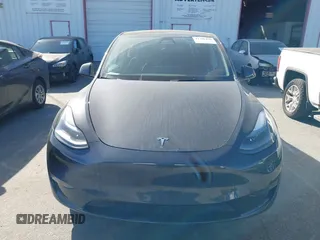 2025 Tesla Model Y Long Range with VIN 7SAYGDED2SF228414, listed as a IAAI auction lot 41706470 with 11,319 mi miles and . Bid and sale history available at DreamBid. Image 12.