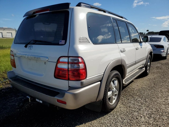 2003 Toyota Land Cruiser with VIN JTEHT05J932033529, listed as a Copart auction lot 73855214 with 0 mi miles and Salvage Title. Bid and sale history available at carsss.com. Image 3.