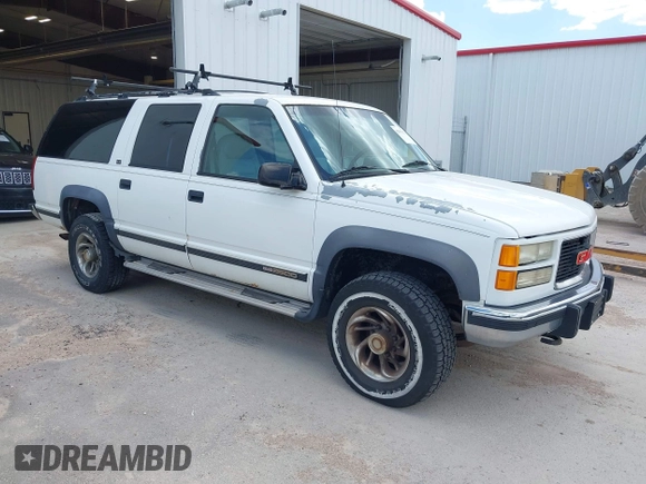 1994 GMC Suburban z VIN 1GKGK26N6RJ771534, wystawiony jako IAAI lot #42359227 z przebiegiem 257 865 mil mil oraz . Historia ofert i sprzedaży dostępna na DreamBid. Obrazek 1.