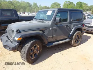 2020 Jeep Wrangler Sport S with VIN 1C4GJXAN5LW146068, listed as a IAAI auction lot 42071619 with 51,238 mi miles and . Bid and sale history available at DreamBid. Image 2.