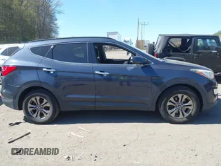 2014 Hyundai Santa Fe z VIN 5XYZUDLB1EG165458, wystawiony jako IAAI lot #42107789 z przebiegiem 94 395 mil mil oraz . Historia ofert i sprzedaży dostępna na DreamBid. Obrazek 13.