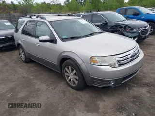 2008 Ford Taurus X SEL z VIN 1FMDK05WX8GA08081, wystawiony jako IAAI lot #42305624 z przebiegiem 159 718 mil mil oraz . Historia ofert i sprzedaży dostępna na DreamBid. Obrazek 1.