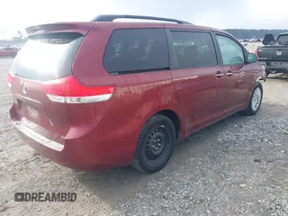 2014 Toyota Sienna XLE with VIN 5TDYK3DCXES471676, listed as a IAAI auction lot 41853038 with 169,790 mi miles. Bid and sale history available at carsss.com. Image 4.