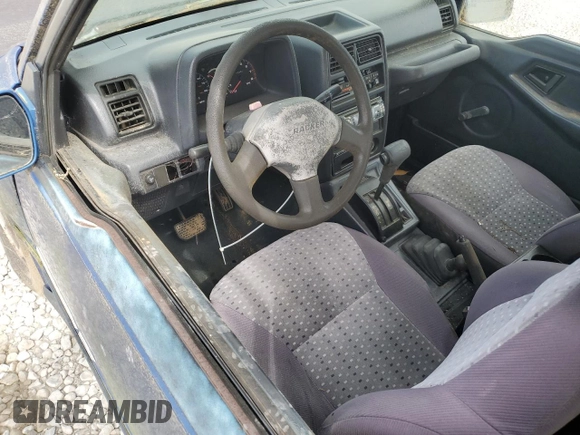 1993 Geo Tracker z VIN 2CNBJ18UXP6921660, wystawiony jako Copart lot #58027275 z przebiegiem 64 349 mil mil oraz Tytuł czysty. Historia ofert i sprzedaży dostępna na DreamBid. Obrazek 8.