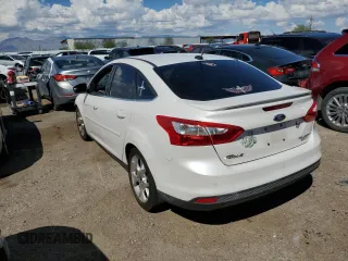 2014 Ford Focus Titanium with VIN 1FADP3J26EL132223, listed as a Copart auction lot 71490004 with 131,233 mi miles and Salvage Title. Bid and sale history available at DreamBid. Image 2.