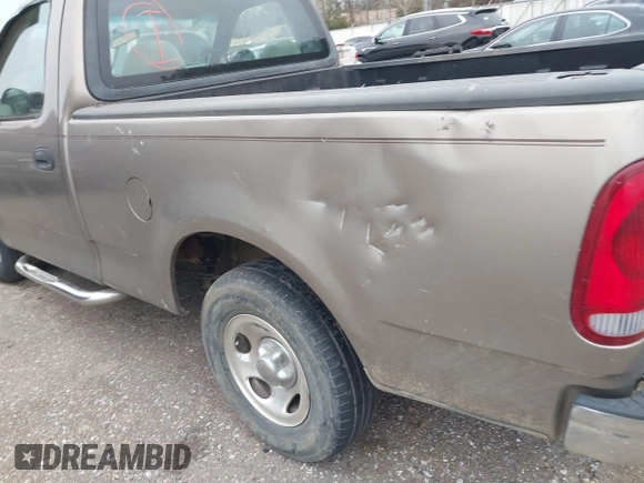 2002 Ford F-150 XL with VIN 3FTRF17212MA23970, listed as a IAAI auction lot 40991449 with 216,487 mi miles. Bid and sale history available at carsss.com. Image 13.