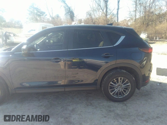 2020 Mazda CX-5 Touring with VIN JM3KFACM1L1817303, listed as a IAAI auction lot 41627859 with 57,268 mi miles. Bid and sale history available at carsss.com. Image 14.