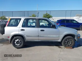 2001 Honda CR-V LX z VIN JHLRD28481S017409, wystawiony jako IAAI lot #41943942 z przebiegiem 134 999 mil mil oraz . Historia ofert i sprzedaży dostępna na DreamBid. Obrazek 13.