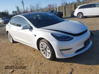 2022 Tesla Model 3 with VIN 5YJ3E1EA5NF185886, listed as a IAAI auction lot 41890744 with 119,724 mi miles. Bid and sale history available at carsss.com. Image 1.