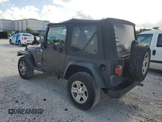 1998 Jeep Wrangler SE with VIN 1J4FY29P6WP705491, listed as a Copart auction lot 61873695 with 195,678 mi miles and Clean title. Bid and sale history available at DreamBid. Image 2.