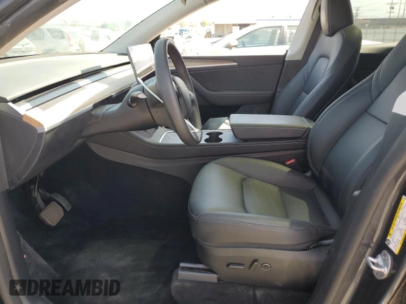 2024 Tesla Model Y Long Range with VIN 7SAYGDEEXRA237667, listed as a Copart auction lot 58260635 with Not provided miles and Salvage title. Bid and sale history available at DreamBid. Image 7.