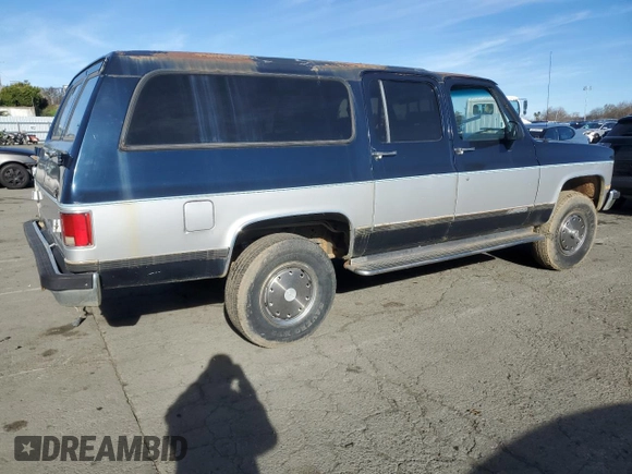 1991 Chevrolet Suburban z VIN 1GNGV26K1MF104219, wystawiony jako Copart lot #87527045 z przebiegiem 189 345 mil mil oraz Czysty tytuł • Clean title. Historia ofert i sprzedaży dostępna na DreamBid. Obrazek 3.