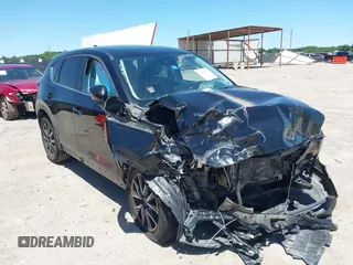 2018 Mazda CX-5 Touring z VIN JM3KFACM3J1339074, wystawiony jako IAAI lot #42317039 z przebiegiem 82 799 mil mil oraz . Historia ofert i sprzedaży dostępna na DreamBid. Obrazek 1.