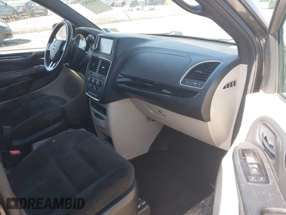 2015 Dodge Grand Caravan SE with VIN 2C4RDGBG2FR684367, listed as a IAAI auction lot 42167621 with 216,628 mi miles and . Bid and sale history available at DreamBid. Image 5.