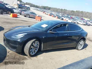 2020 Tesla Model 3 Standard Range Plus with VIN 5YJ3E1EA0LF660759, listed as a IAAI auction lot 41505250 with 63,322 mi miles and . Bid and sale history available at DreamBid. Image 14.