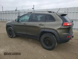 2015 Jeep Cherokee Trailhawk with VIN 1C4PJMBS0FW678738, listed as a Copart auction lot 50651235 with 147,793 mi miles and Salvage title. Bid and sale history available at DreamBid. Image 2.