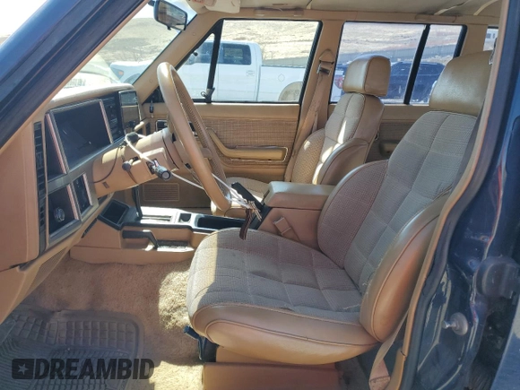 1987 Jeep Cherokee with VIN 1JCMT7842HT114597, listed as a Copart auction lot 49319945 with 230,675 mi miles and Clean title. Bid and sale history available at DreamBid. Image 7.