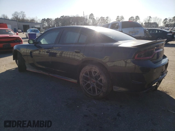 2018 Dodge Charger Daytona with VIN 2C3CDXCT4JH283018, listed as a Copart auction lot 48707905 with 121,624 mi miles and Salvage title. Bid and sale history available at DreamBid. Image 2.