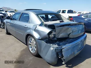 2006 Chrysler 300 C with VIN 2C3KA63H56H313967, listed as a IAAI auction lot 42056998 with 143,592 mi miles and . Bid and sale history available at carsss.com. Image 6.