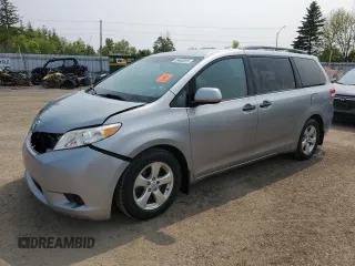2014 Toyota Sienna L with VIN 5TDZK3DC8ES442973, listed as a Copart auction lot 59660055 with 310,496 mi miles and Salvage title. Bid and sale history available at DreamBid. Image 1.