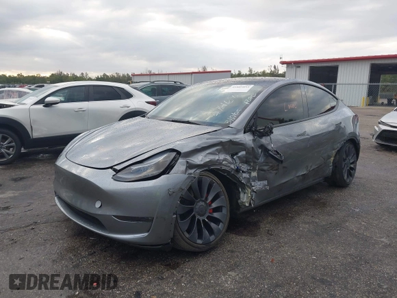 2024 Tesla Model Y Performance with VIN 7SAYGDEF3RA307468, listed as a IAAI auction lot 41805853 with 10,377 mi miles and . Bid and sale history available at DreamBid. Image 6.