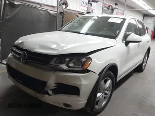 2012 Volkswagen Touareg Sport with VIN WVGFK9BP2CD002991, listed as a IAAI auction lot 42077523 with 94,515 mi miles and . Bid and sale history available at DreamBid. Image 2.