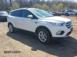 2018 Ford Escape SE z VIN 1FMCU9GD4JUB06181, wystawiony jako IAAI lot #42046708 z przebiegiem 160 987 mil mil oraz . Historia ofert i sprzedaży dostępna na DreamBid. Obrazek 1.