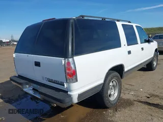1997 Chevrolet Suburban with VIN 3GNFK16R4VG126095, listed as a IAAI auction lot 41548470 with 290,502 mi miles. Bid and sale history available at carsss.com. Image 4.
