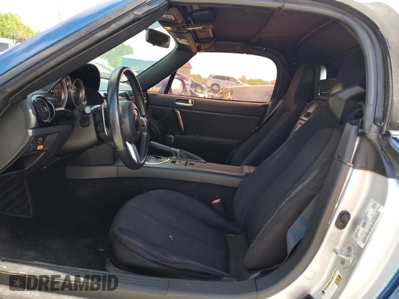 2006 Mazda MX-5 Miata Sport z VIN JM1NC25F760122353, wystawiony jako Copart lot #53557585 z przebiegiem 150 409 mil mil oraz Szkoda całkowita • Salvage title. Historia ofert i sprzedaży dostępna na DreamBid. Obrazek 7.