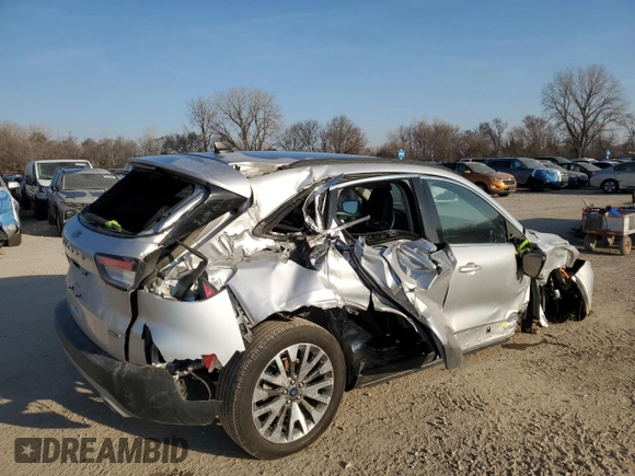 2020 Ford Escape Titanium Hybrid z VIN 1FMCU9DZ4LUC34827, wystawiony jako Copart lot #48769685 z przebiegiem 84 218 mil mil oraz Szkoda całkowita • Salvage title. Historia ofert i sprzedaży dostępna na DreamBid. Obrazek 3.