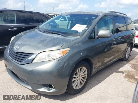 2014 Toyota Sienna XLE with VIN 5TDYK3DC2ES448876, listed as a IAAI auction lot 42519351 with 154,601 mi miles and . Bid and sale history available at DreamBid. Image 2.
