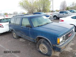 1993 GMC Jimmy Diamond Edition Luxury with VIN 1GKDT13W3P2537947, listed as a IAAI auction lot 41949379 with 1 mi miles. Bid and sale history available at carsss.com. Image 1.