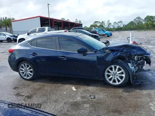 2015 Mazda 3 S Grand Touring z VIN JM1BM1W35F1238188, wystawiony jako IAAI lot #41206030 z przebiegiem 316 542 mil mil oraz . Historia ofert i sprzedaży dostępna na DreamBid. Obrazek 13.