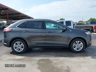 2020 Ford Edge SEL z VIN 2FMPK3J9XLBA54556, wystawiony jako IAAI lot #42179907 z przebiegiem 63 449 mil mil oraz . Historia ofert i sprzedaży dostępna na DreamBid. Obrazek 13.