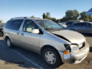 2002 Toyota Sienna LE with VIN 4T3ZF13C52U505287, listed as a Copart auction lot 77164884 with 0 mi miles and Salvage Title. Bid and sale history available at carsss.com. Image 4.