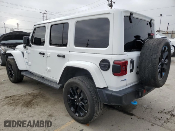 2023 Jeep Wrangler Sahara with VIN 1C4JJXP63PW536694, listed as a Copart auction lot 63409845 with 32,560 mi miles and Salvage title. Bid and sale history available at DreamBid. Image 2.