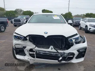 2021 BMW X6 xDrive40i z VIN 5UXCY6C00M9F88215, wystawiony jako IAAI lot #41646498 z przebiegiem 43 587 mil mil oraz . Historia ofert i sprzedaży dostępna na DreamBid. Obrazek 12.