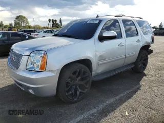 2014 GMC Yukon SLT with VIN 1GKS1CE05ER197674, listed as a Copart auction lot 45934674 with 130,623 mi miles and Salvage Title. Bid and sale history available at carsss.com. Image 1.