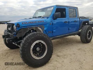 2021 Jeep Gladiator Rubicon с VIN 1C6JJTBM1ML611203, выставлен на аукционе Copart как лот 87203924 с пробегом 27 645 миль миль и Списание • Salvage title. История ставок и продаж доступна на DreamBid. Изображение 1.
