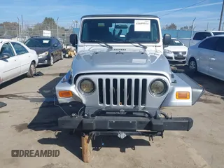 2004 Jeep Wrangler Rubicon with VIN 1J4FA69S94P701660, listed as a IAAI auction lot 41699554 with 74,640 mi miles. Bid and sale history available at carsss.com. Image 13.